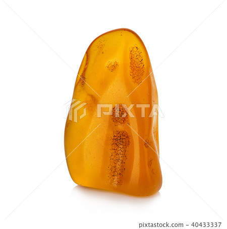 Piece of amber isolated on white background Piece of amber isolated on white background 40433337