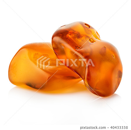 pieces of amber close-up isolated on a white. pieces of amber close-up isolated on a white. 40433338