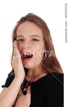 Woman talking behind her hand 40433539