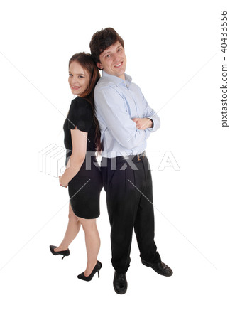 Lovely couple standing back to back Lovely couple standing back to back 40433556