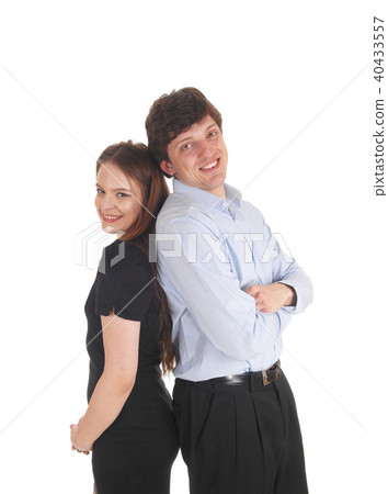 Young couple standing back to back Young couple standing back to back 40433557