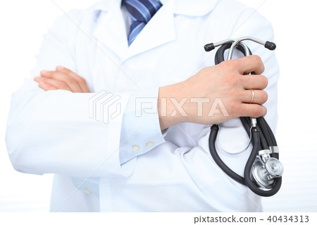 Close Up of Unknown male doctor standing straight while holding stethoscope. Medicine and health 40434313