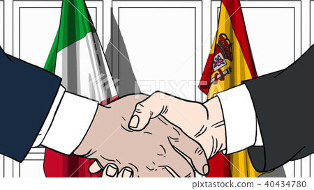 Businessmen or politicians shaking hands against flags of Italy and Spain. Meeting or cooperation Businessmen or politicians shaking hands against flags of Italy and Spain. Meeting or cooperation 40434780