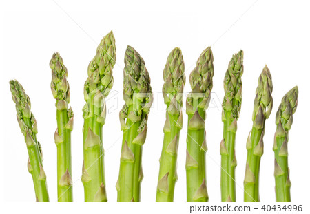 Fresh green asparagus tips in a row over white 40434996
