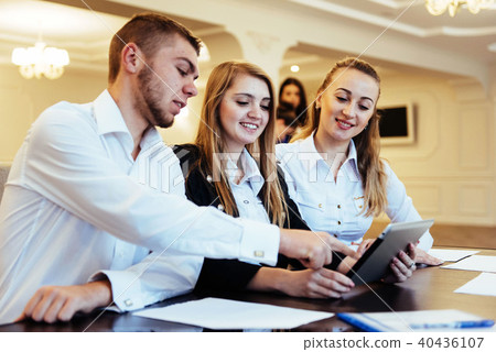 Group of students studying using a laptop Group of students studying using a laptop 40436107