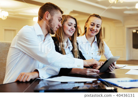 Group of students studying using a laptop Group of students studying using a laptop 40436131