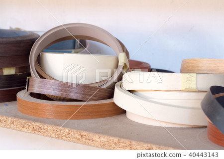 Furniture accessories. Multicolored bobbins of PVC edge and melanin for the manufacture of furniture 40443143