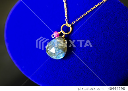 A necklace placed on the case 40444298