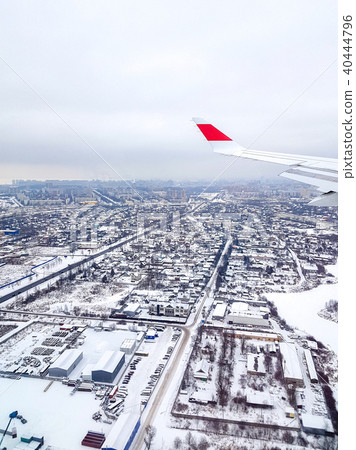 Earth, city and plane wing 40444796