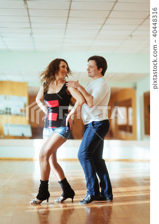 Beautiful couple of professional artists dancing passionate danc Beautiful couple of professional artists dancing passionate danc 40448316