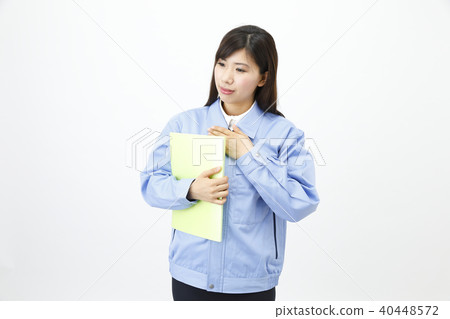 Woman dressed in work clothes Woman dressed in work clothes 40448572