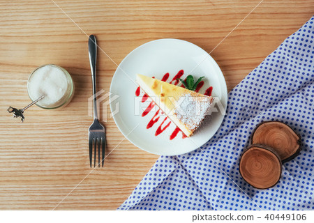 triangle cheese cakes in cafe. On a wooden table 40449106