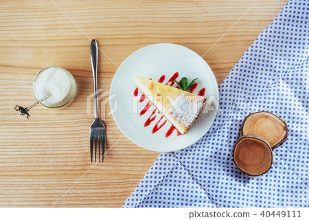 triangle cheese cakes in cafe. On a wooden table 40449111