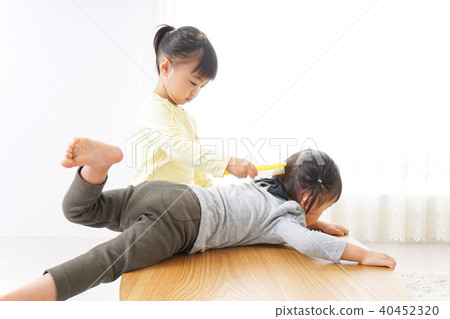 Two kids playing beautician Two kids playing beautician 40452320