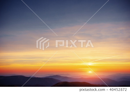 colorful sky with sun background in mountains. sunset, sunrise colorful sky with sun background in mountains. sunset, sunrise 40452872