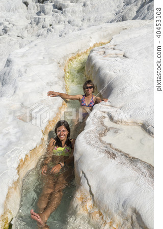 Women in Pamukkale thermal river 40453108