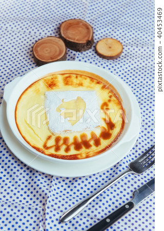 Delicious cheese casserole in a ceramic pot. Delicious cheese casserole in a ceramic pot. 40453469