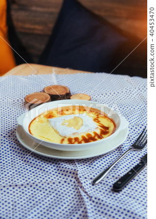 Delicious cheese casserole in a ceramic pot. Delicious cheese casserole in a ceramic pot. 40453470