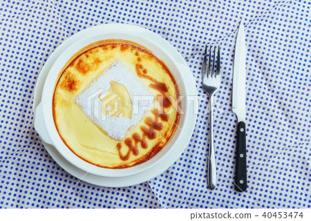 Delicious cheese casserole in a ceramic pot. Delicious cheese casserole in a ceramic pot. 40453474