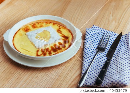 Delicious cheese casserole in a ceramic pot. Delicious cheese casserole in a ceramic pot. 40453479