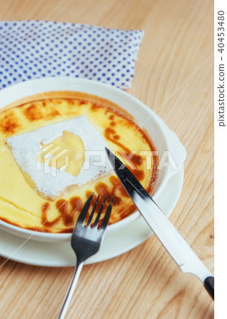 Delicious cheese casserole in a ceramic pot. Delicious cheese casserole in a ceramic pot. 40453480
