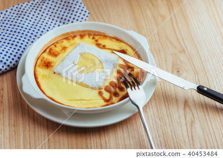 Delicious cheese casserole in a ceramic pot. Delicious cheese casserole in a ceramic pot. 40453484