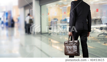 Businessman holding a briefcase 40453615