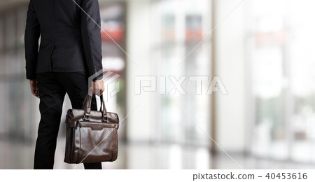 Businessman holding a briefcase 40453616