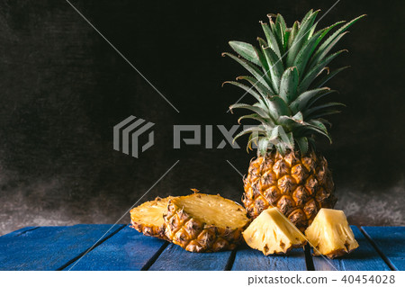 Fresh Pineapple fruit on a blue wooden table. Fresh Pineapple fruit on a blue wooden table. 40454028