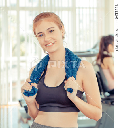 Fitness woman smiling with friend work out  40455368