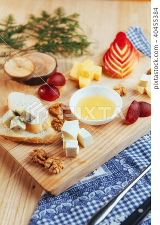plate with blue cheese Dor, parmesan, Brie 40455384