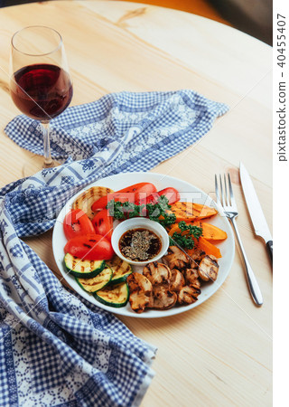 grilled vegetables with sauce on a wooden background 40455407