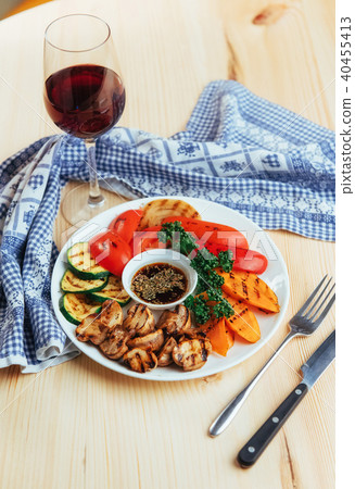 grilled vegetables with sauce on a wooden background grilled vegetables with sauce on a wooden background 40455413