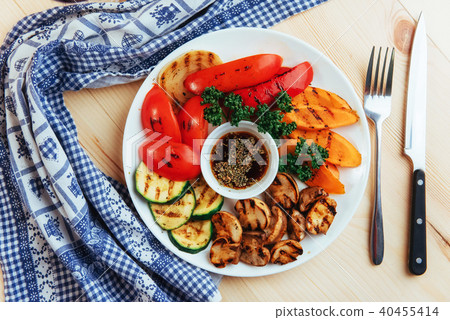 grilled vegetables with sauce on a wooden background 40455414