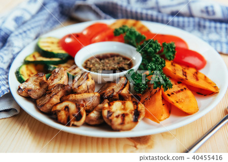 grilled vegetables with sauce on a wooden background grilled vegetables with sauce on a wooden background 40455416