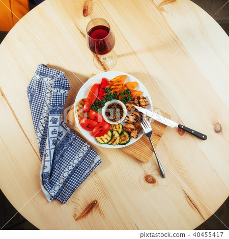 grilled vegetables with sauce on a wooden background 40455417