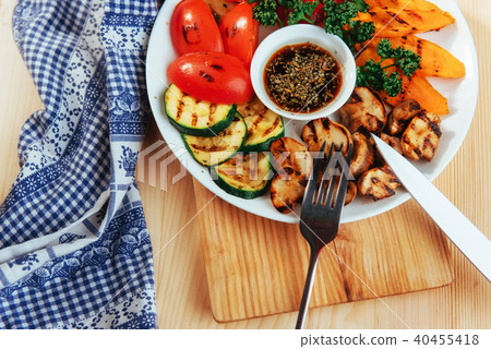 grilled vegetables with sauce on a wooden background grilled vegetables with sauce on a wooden background 40455418