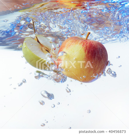 apple in water on a white background apple in water on a white background 40456873