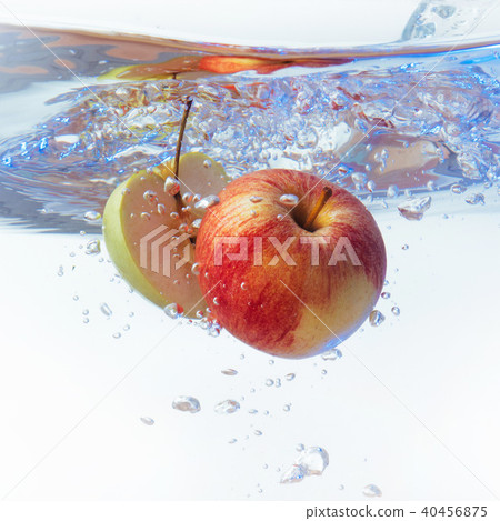 apple in water on a white background apple in water on a white background 40456875