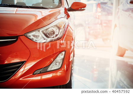 Headlights and hood of sport red car. Headlights and hood of sport red car. 40457592