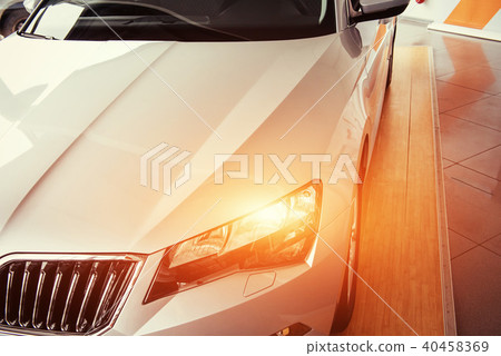 The headlights and the hood of a black sports car The headlights and the hood of a black sports car 40458369