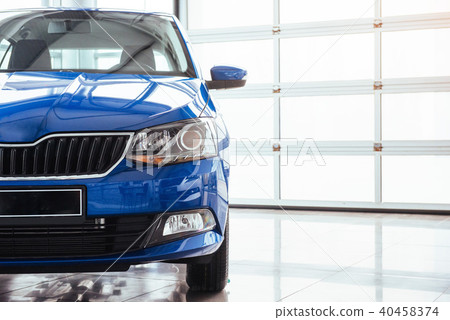 The headlights and hood Blue car The headlights and hood Blue car 40458374