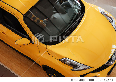 of the car in the spacious showroom with large windows 40459374