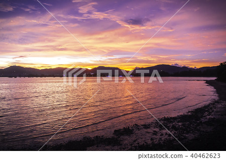Colorful sunset sky over mountain on seascape Colorful sunset sky over mountain on seascape 40462623