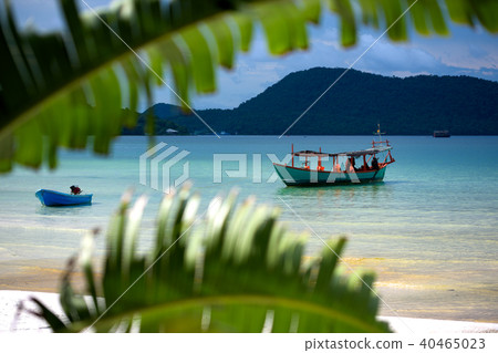 Green Longtail boat moored in Saracen Bay  40465023