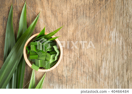 Fresh green pandan in a wooden bowl on wood table Fresh green pandan in a wooden bowl on wood table 40466484