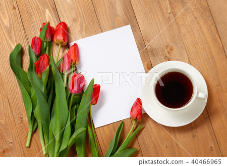 tulips are on wooden boards, cup of coffee tulips are on wooden boards, cup of coffee 40466965