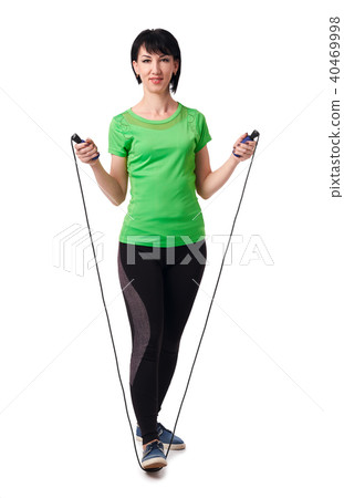 girl posing with skipping rope in studio 40469998