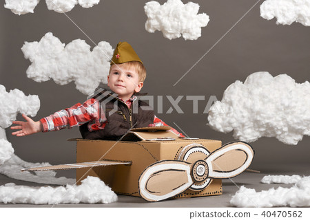 boy plays airplane and dreams of becoming a pilot boy plays airplane and dreams of becoming a pilot 40470562