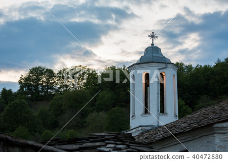 Orthodox church lit dome with cross at evening Orthodox church lit dome with cross at evening 40472880
